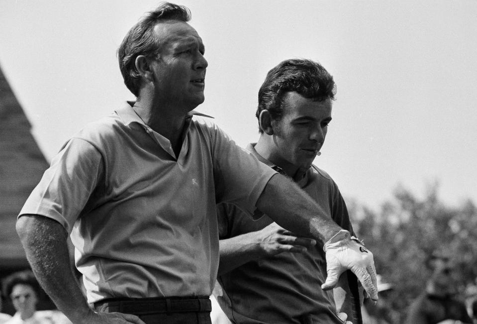 Arnold Palmer, left, and Tony Jacklin scan the fairway at Southern Hills Country Club, in Tulsa on Aug. 11, 1970, during a practice round.