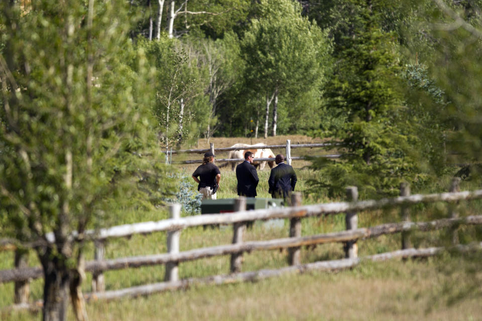 Secret Service agents and Aspen police stand guard outside a fundraiser for Republican presidential candidate, former Massachusetts Gov. Mitt Romney on Monday, July 9, 2012 in Aspen, Colo. (AP Photo/Evan Vucci)