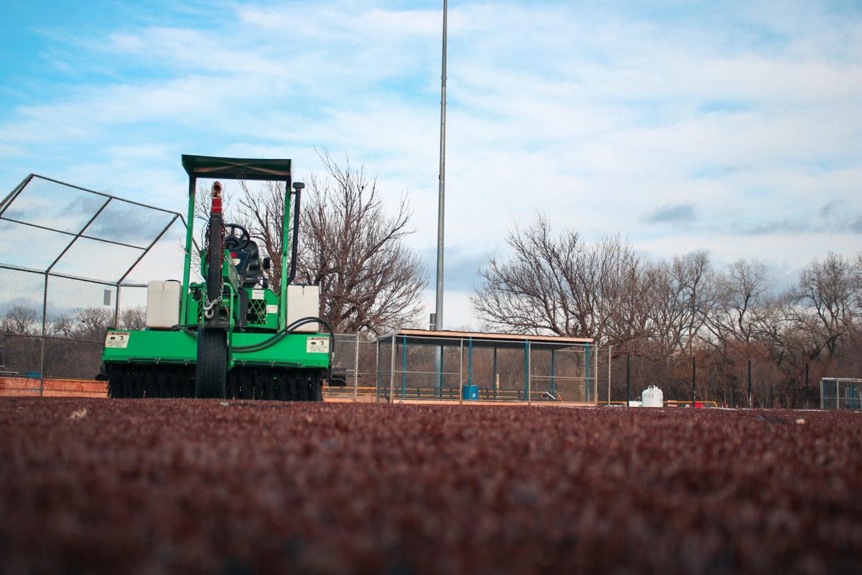 Turfing equipment sits on a softball field at Bill Burke Park.