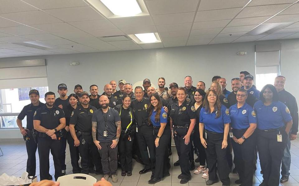 Miami Springs Police Chief Armando Guzman, center, is flanked by Springs police officers. Hired in 2015, Guzman is retiring as chief on Feb. 27, 2024.