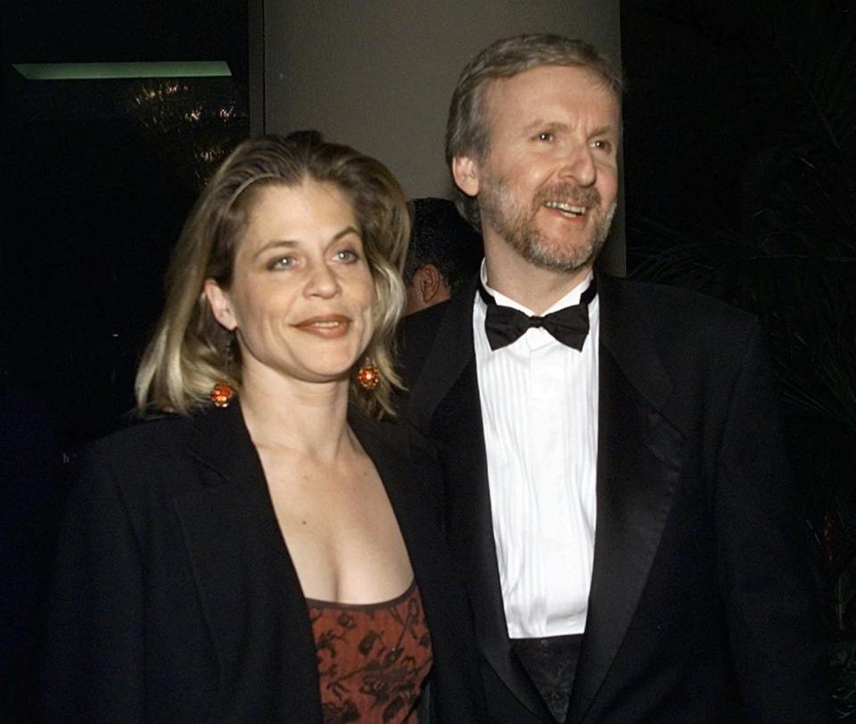 Director producer of "Titanic" James Cameron, right, and actress Linda Hamilton arrive to the Producers Guild Golden Laurel Awards Tuesday, March 3, 1998, in Beverly Hills, Calif.  Cameron is nominated for the Darryl F. Zanuck Theatrical Motion Picture Producer of the Year Award. (AP Photo/Kevork Djansezian)