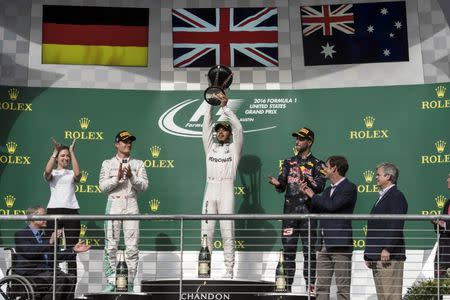 Oct 23, 2016; Austin, TX, USA; Mercedes driver Lewis Hamilton (44) of Great Britain celebrates winning the United States Grand Prix at the Circuit of the Americas. Mandatory Credit: Jerome Miron-USA TODAY Sports