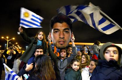 Uruguayans have been unwavering in their support of Suarez after his third biting incident. (AP)