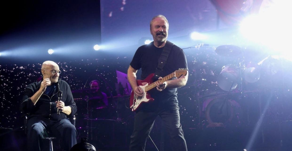 Milwaukee native and guitarist Daryl Stuermer performs with Genesis (including frontman Phil Collins, to Stuermer's right) as part of the band's "The Last Domino?" tour.