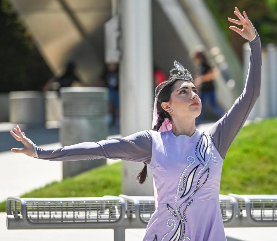 A soloist from the American Dance Group of Fresno performs a traditional Armenian dance during the annual Armenian Flag Raising Ceremony outside Fresno City Hall, on Monday, April 24, 2023.