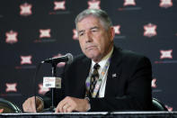 FILE - In this March 11, 2020, file photo, Big 12 Commissioner Bob Bowlsby announces no fans will be admitted to the rest of the Big 12 basketball tournament, in Kansas City, Kan. After the Power Five conference commissioners met Sunday, Aug. 9, 2020, to discuss mounting concern about whether a college football season can be played in a pandemic, players took to social media to urge leaders to let them play. (AP Photo/Orlin Wagner, File)