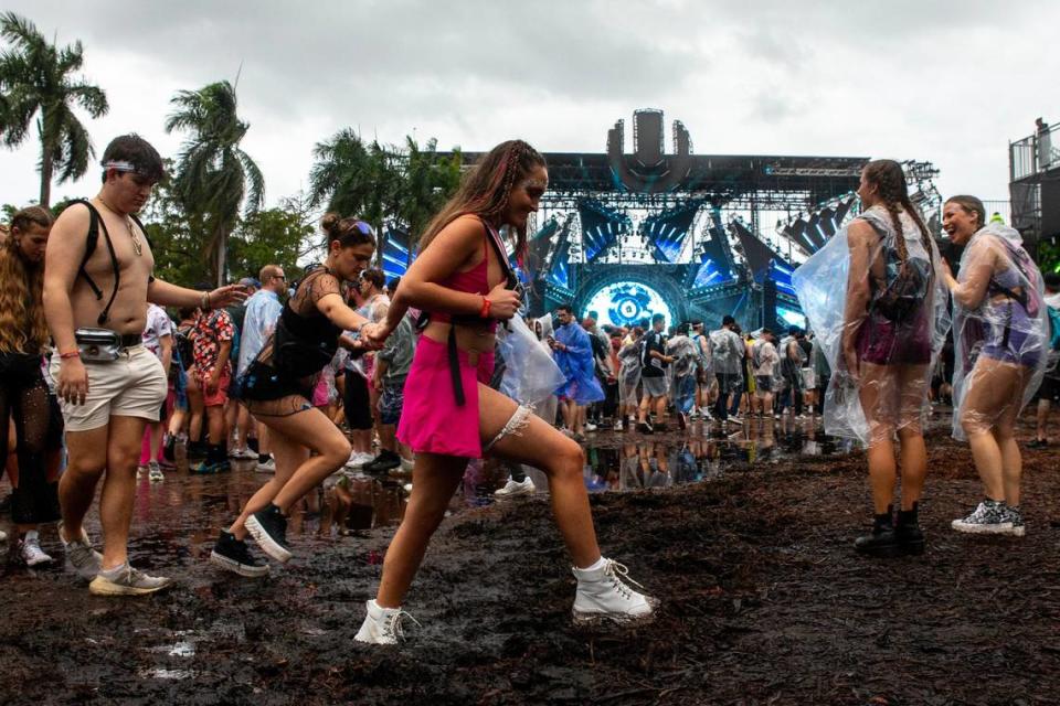 Festival goers walk through the mud during Ultra 2024 at Bayfront Park in Downtown Miami on Friday, March 22, 2024.