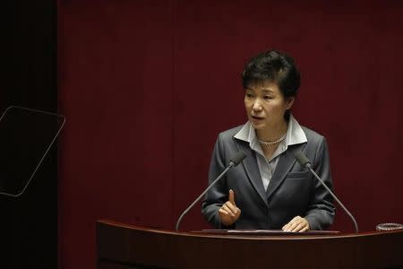 South Korean President Park Geun-hye delivers her speech on 2015's budget bill during a plenary session at the National Assembly in Seoul October 29, 2014. REUTERS/Kim Hong-Ji