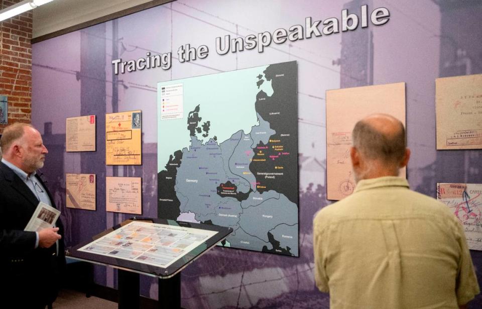 Visitors browse the new exhibit at the American Philatelic Society, “A Philatelic Memorial of the Holocaust,” on Wednesday, May 31, 2023.
