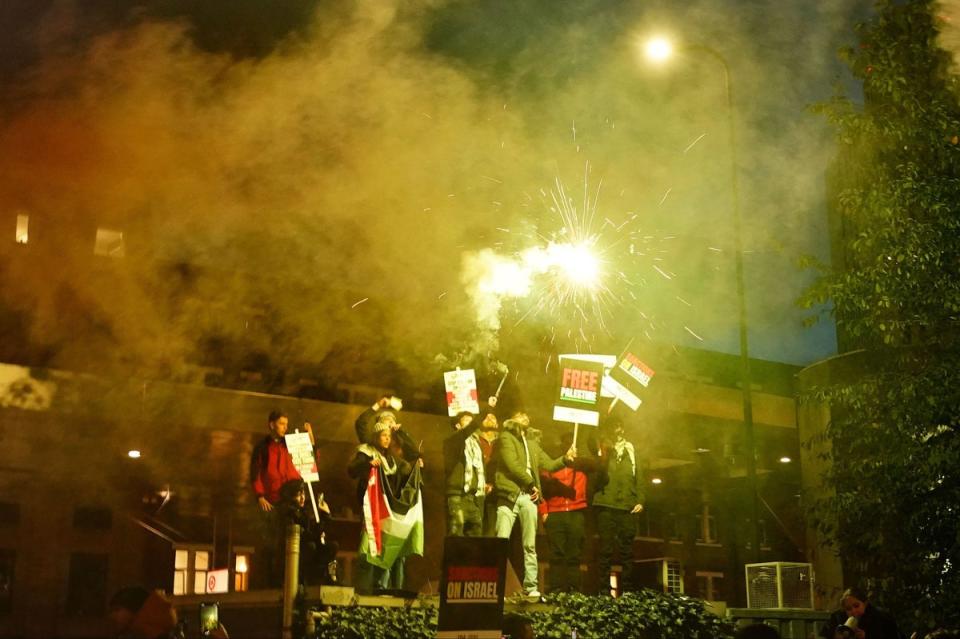 People set off fireworks during a pro-Palestinian protest in London (PA)