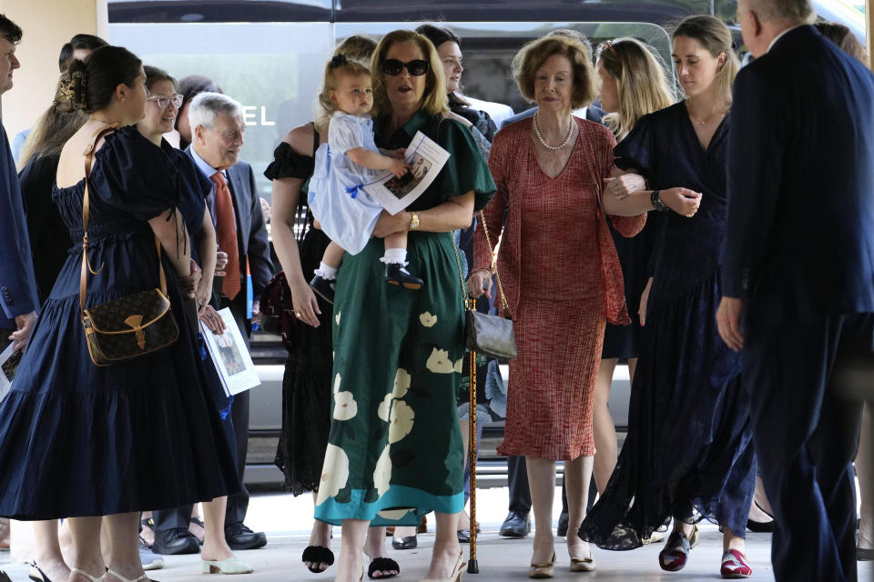 Adele Graham, second from right wearing pearl necklace, wife of U.S. Sen. and two-term Florida Gov. Bob Graham, arrives with family members for a public celebration of life service for Bob Graham, Saturday, May 11, 2024, in Miami Lakes, Fla. About 200 people gathered for a memorial service at the Miami Lakes United Church of Christ for Graham who died last month at the age of 87. (AP Photo/Lynne Sladky)