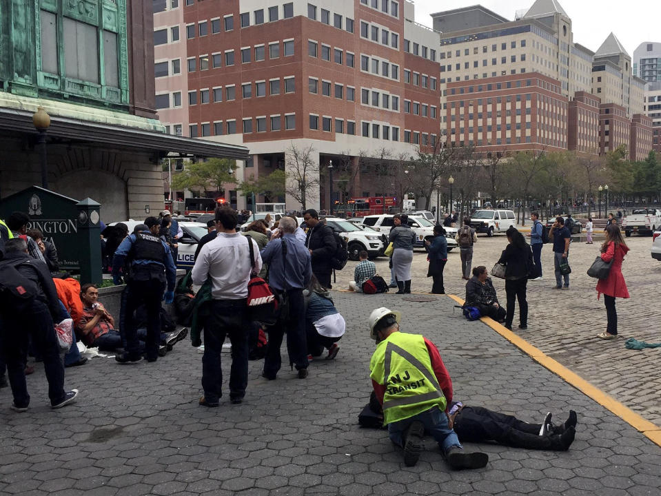 <p>People are treated for their injuries outside after a NJ Transit train crashed in to the platform at Hoboken Terminal September 29, 2016 in Hoboken, New Jersey. (Pancho Bernasconi/Getty Images) </p>