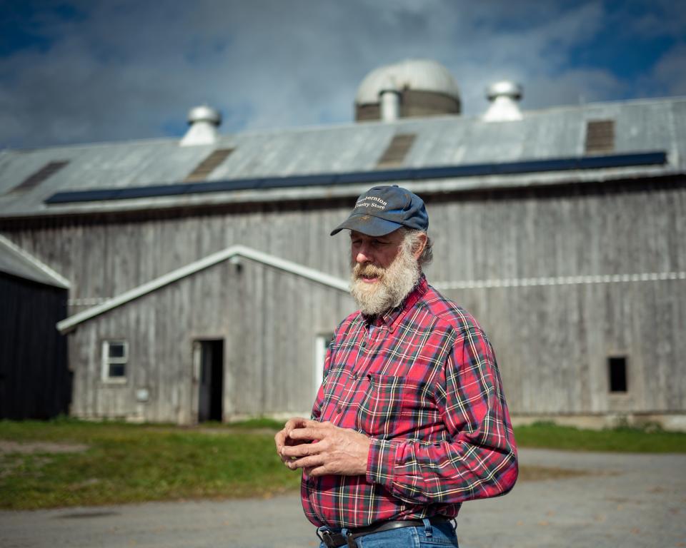 Ben Simmons stands outside of his home and farm on Starr Hill in Remsen, NY.