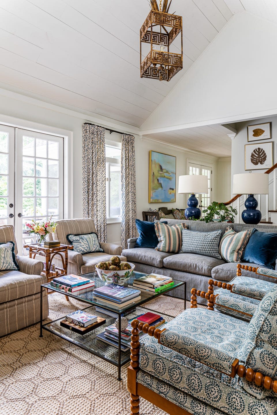 family room with blue, white, and tan upholstery