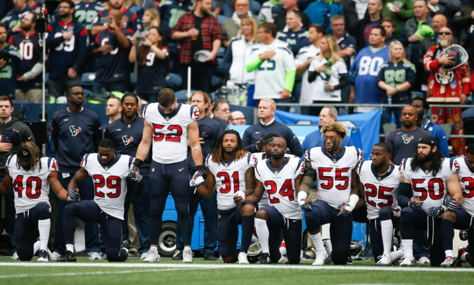 Houston Texans take a knee. (Getty)