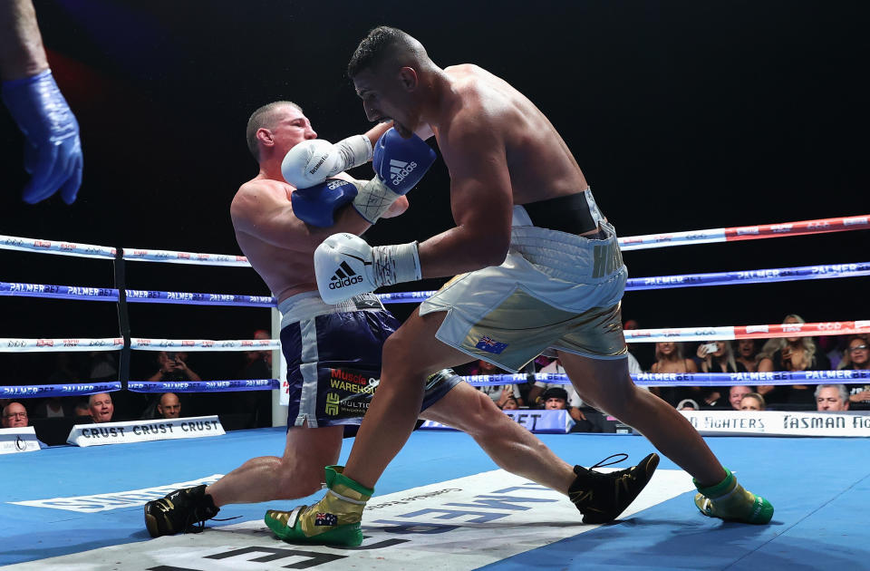 Justis Huni knocks Paul Gallen to the canvas during their Australian heavyweight title fight at ICC Sydney on June 16, 2021 in Sydney, Australia.