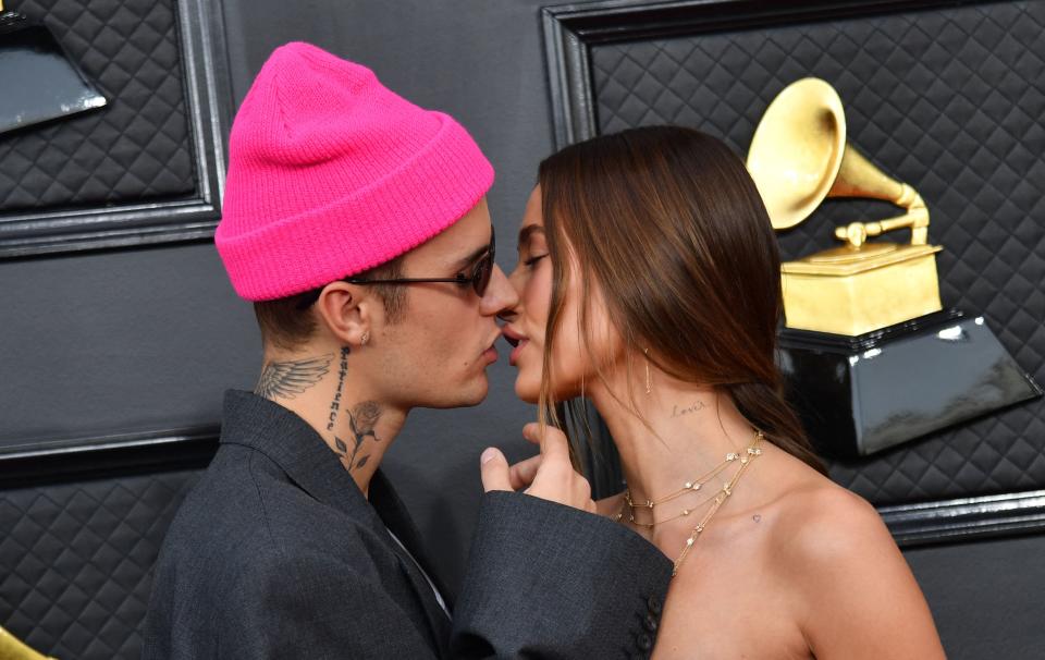 Justin Bieber and model Hailey Bieber kiss at the grammys