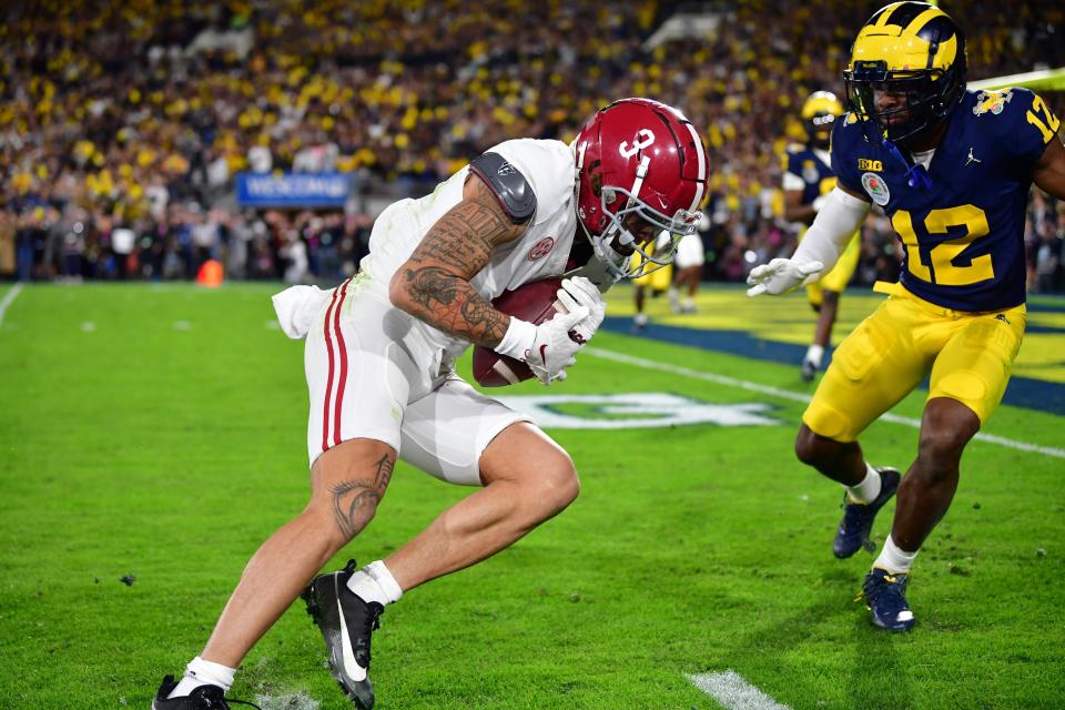 Jan 1, 2024; Pasadena, CA, USA; Alabama Crimson Tide wide receiver Jermaine Burton (3) makes a catch against Michigan Wolverines defensive back Josh Wallace (12) in overtime in the 2024 Rose Bowl college football playoff semifinal game at Rose Bowl. Mandatory Credit: Gary A. Vasquez-USA TODAY Sports