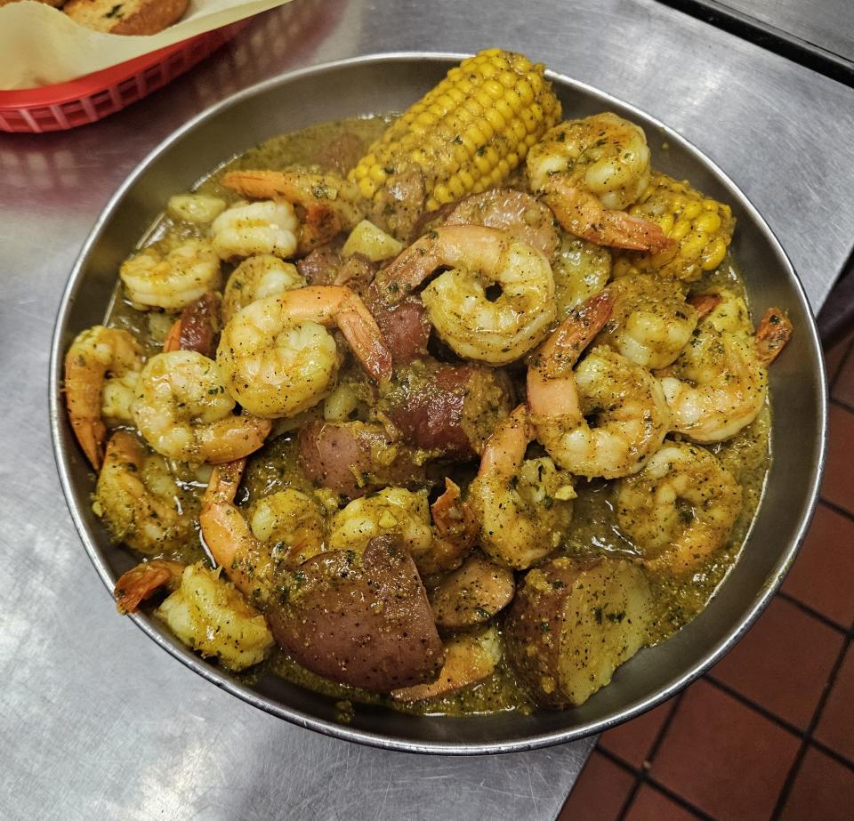 The Louisiana Shabang Shrimp Boil includes andouille sausage, red potatoes, corn on the cob and, of course, shrimp. The sauce pictured is Lemon Garlic.