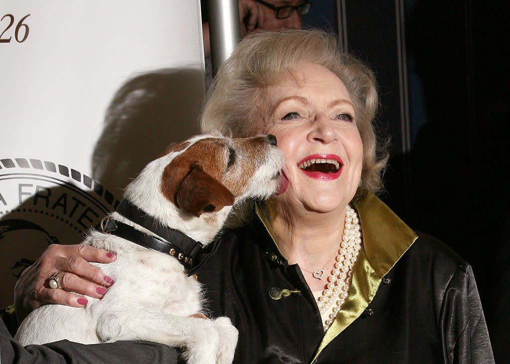 Actress Betty White (R) and Uggie the dog attends The Friars Club Salute To Betty White at Sheraton New York Hotel & Towers on May 16, 2012 in New York City.