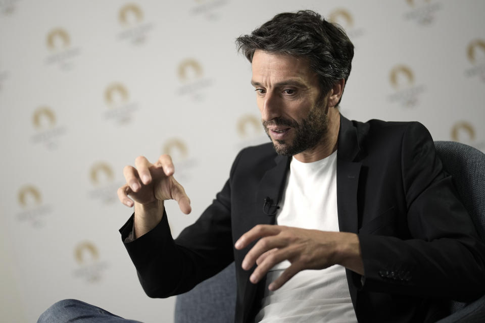 Paris 2024 Olympics Organizing Committee President Tony Estanguet gestures during an interview with the Associated Press in Saint-Denis, outside Paris, France, Tuesday, June 27, 2023. (AP Photo/Christophe Ena)