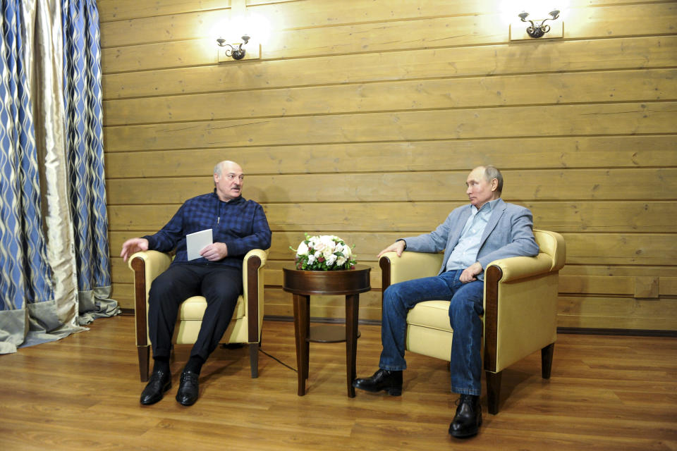 Russian President Vladimir Putin, right, and Belarusian President Alexander Lukashenko during their meeting in the Black Sea resort of Sochi, Russia, Monday, Feb. 22, 2021. (Alexei Druzhinin, Sputnik, Kremlin Pool Photo via AP)