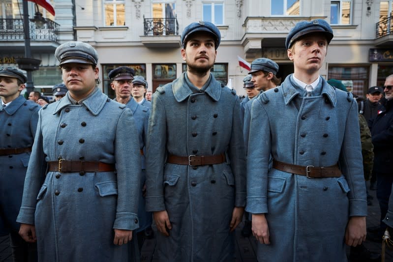 People take part in a parade marking the National Independence Day in Lodz