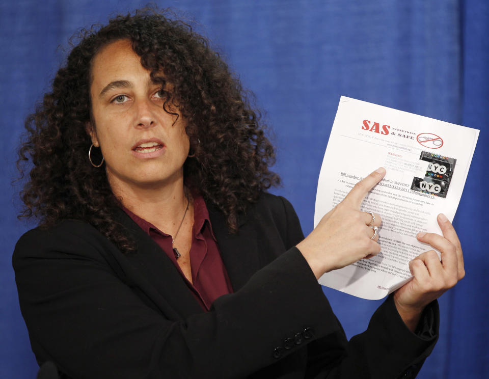 Andrea Ritchie of Streetwise and Safe holds a memorandum with a condom attached that was sent to state legislators during a news conference in Albany, N.Y., on Tuesday, April 17, 2012. Advocates for New York prostitutes want authorities to stop taking condoms as evidence in criminal cases, calling it unhealthy. They're lobbying for bills to make New York the first state to ban the practice. (AP Photo/Mike Groll)