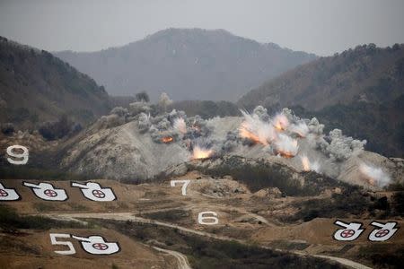 Explosions are seen at a target, during a U.S.-South Korea joint live-fire military exercise, at a training field, near the demilitarized zone, separating the two Koreas in Pocheon, South Korea April 21, 2017. Picture taken on April 21, 2017. REUTERS/Kim Hong-Ji