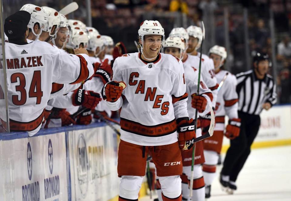 Carolina Hurricanes center Ryan Dzingel (18) is congratulated for his goal during the first period of the team’s NHL hockey game against the Florida Panthers on Tuesday, Oct. 8, 2019, in Sunrise, Fla.