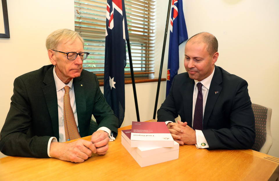 Commissioner Hayne and Josh Frydenberg. Image: AAP