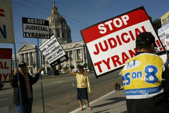 Supporters of California's Proposition 8 ban on gay marriage protest outside the California Supreme Court in San Francisco, California before a hearing on the initiative September 6, 2011. California voters banned same sex weddings in 2008 by approving so-called Proposition 8. But last year a U.S. district judge ruled the measure unconstitutional. The hearing discusses whether supporters of an initiative like Proposition 8, could defend a ballot proposition if state leaders did not, a technical yet crucial legal issue in the closely watched gay marriage case.