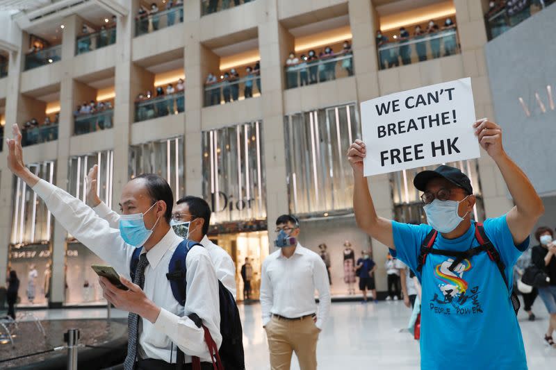 Pro-democracy demonstrators stage a rally at a shopping mall in Hong Kong