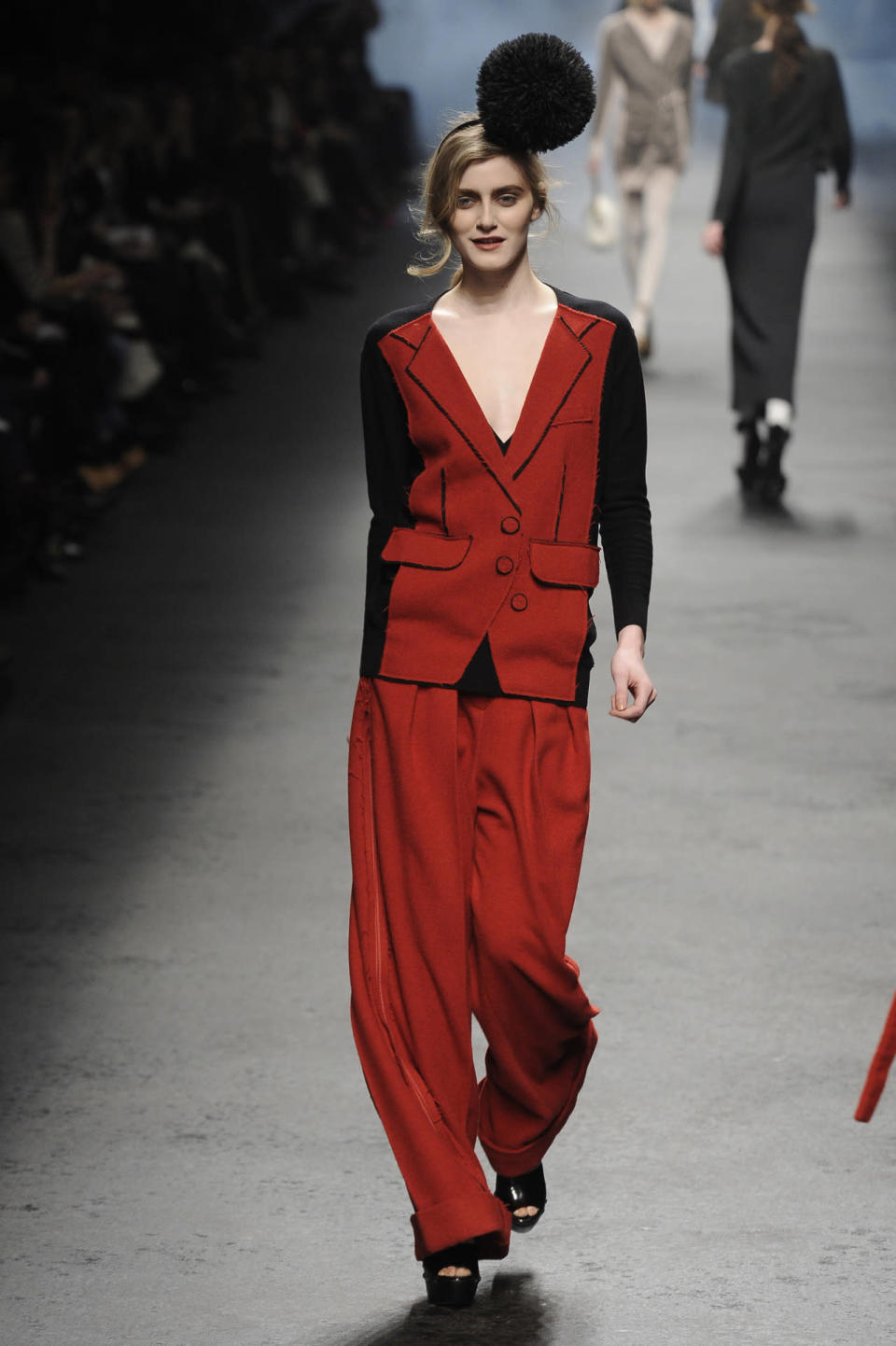 A model wears a black-and-red suit with trompe l'oeil details at the fall 2010 Sonia Rykiel show in Paris.