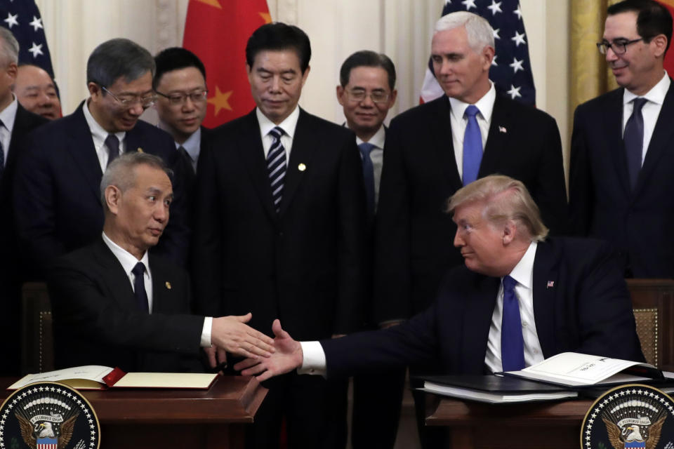 President Donald Trump shakes hands with Chinese Vice Premier Liu He, after signing a trade agreement in the East Room of the White House, Wednesday, Jan. 15, 2020, in Washington. (AP Photo/Evan Vucci)