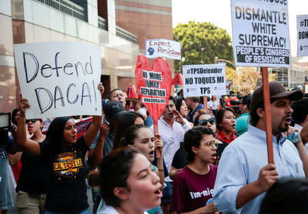 Protesters gather to show support for the Deferred Action for Childhood Arrivals (DACA) program recipient during a rally outside the Federal Building in Los Angeles, California, U.S., September 1, 2017. REUTERS/Kyle Grillot