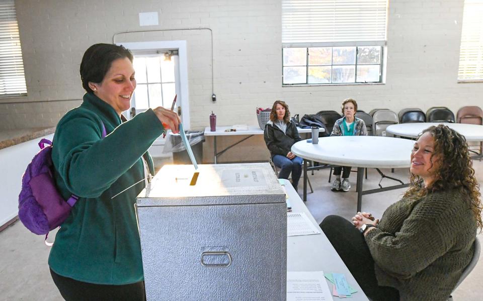 Stephanie Albert, left, votes near poll manager Brittany Polovitz during elections in Iva, S.C. Tuesday, November 7, 2023.