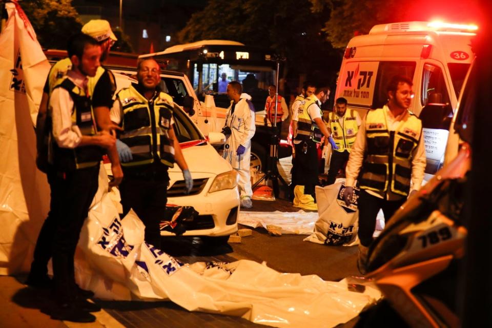 Israeli medics at the scene of a stabbing attack in the ultra-Orthodox city of Elad (EPA)