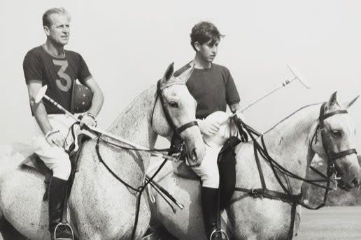 Prince Philip playing polo with his son the Prince of Wales in 1966PA