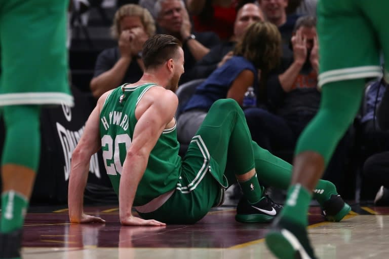 Gordon Hayward of the Boston Celtics sits on the floor after breaking his left leg while playing the Cleveland Cavaliers, at Quicken Loans Arena in Cleveland, Ohio, on October 17, 2017