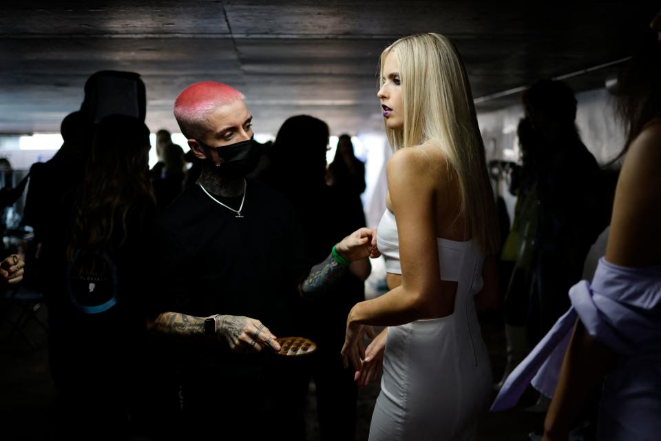 <p>A model is prepared backstage ahead of the catwalk show from British designer Mark Fast during a catwalk show for the Spring/Summer 2022 collection on the first day of London Fashion Week in London on September 17, 2021. (Photo by Tolga Akmen / AFP) (Photo by TOLGA AKMEN/AFP via Getty Images)</p>
