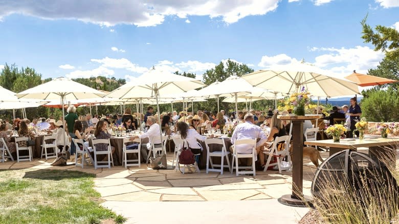 people sitting under parasols