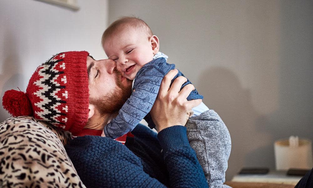 A father and baby having a cuddle