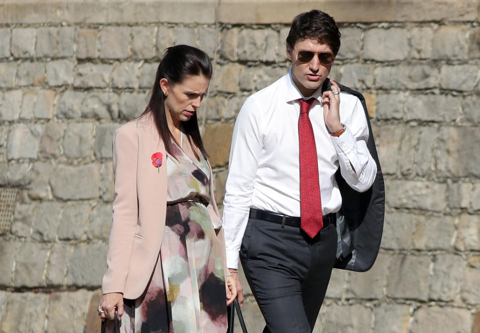 New Zealand’s Prime Minister Jacinda Ardern and Canada’s Prime Minister Justin Trudeau walk through the grounds of Windsor Castle in Windsor, Britain, April 20, 2018. Andrew Matthews/Pool via Reuters