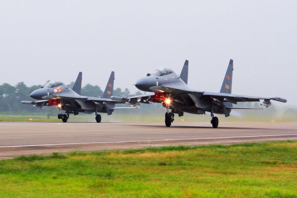 Two Chinese fighter jets take off to fly a patrol over the South China Sea in 2016. Jin Danhua/Xinhua/AP