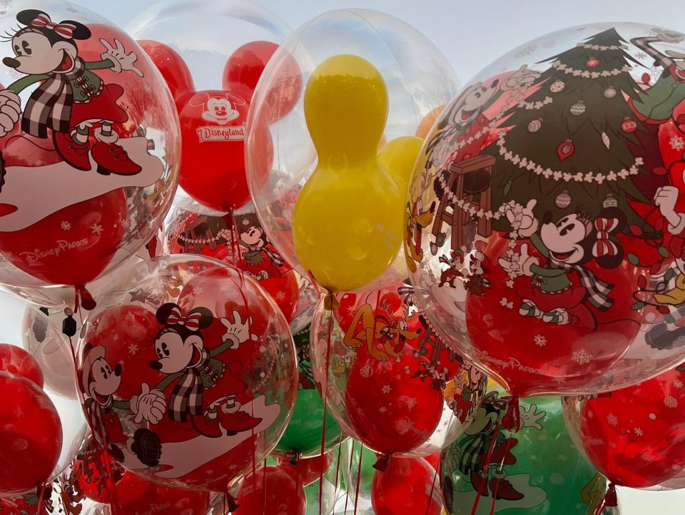 bundle of mickey mouse and christmas balloons at disneyland