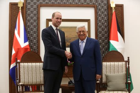 Palestinian President Mahmoud Abbas shakes hands with Britain's Prince William during their meeting in Ramallah, in the occupied West Bank June 27, 2018. Alaa Badarneh/Pool via Reuters