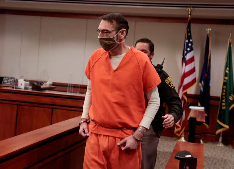 FILE PHOTO: James Crumbley, parent of accused Oxford High School gunman Ethan Crumbley, is escorted into the courtroom by a Oakland Count Sheriff