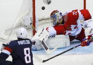 Team USA's Joe Pavelski (8) scores on Russia's goalie Sergei Bobrovski during the third period of their men's preliminary round ice hockey game at the 2014 Sochi Winter Olympic Games, February 15, 2014. REUTERS/Brian Snyder (RUSSIA - Tags: OLYMPICS SPORT ICE HOCKEY TPX IMAGES OF THE DAY)