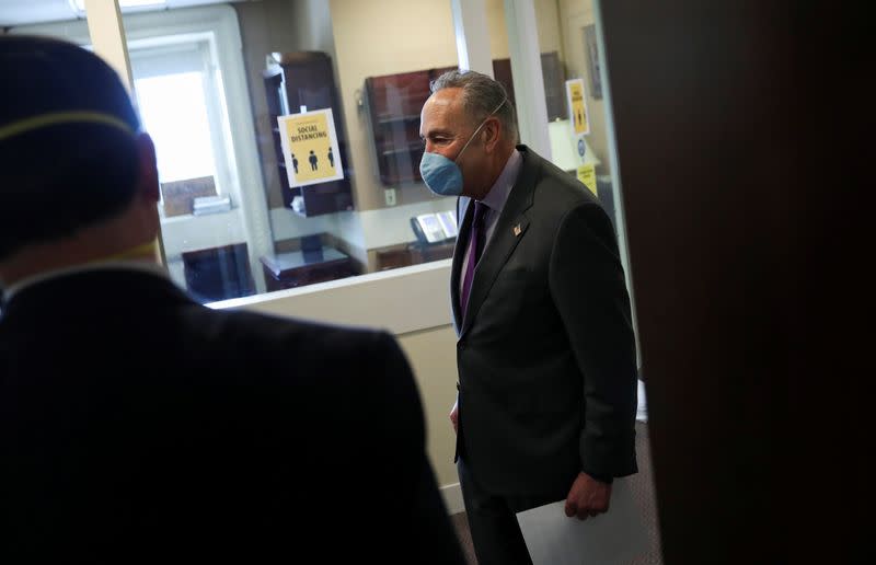 U.S. Senate Minority Leader Chuck Schumer arrives for COVID-19 news conference wearing mask on Capitol Hill in Washington
